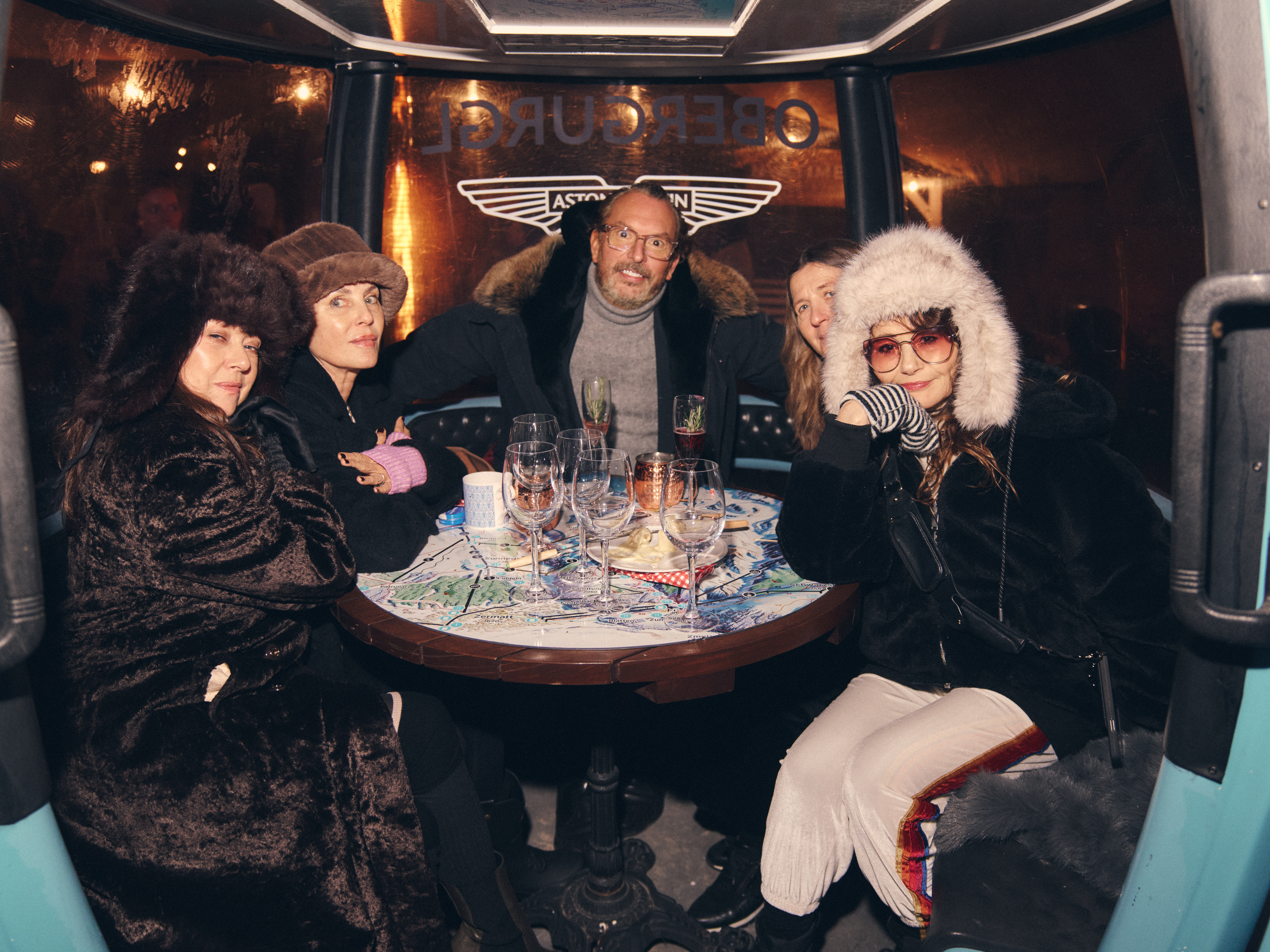 guests sitting in ski gondola