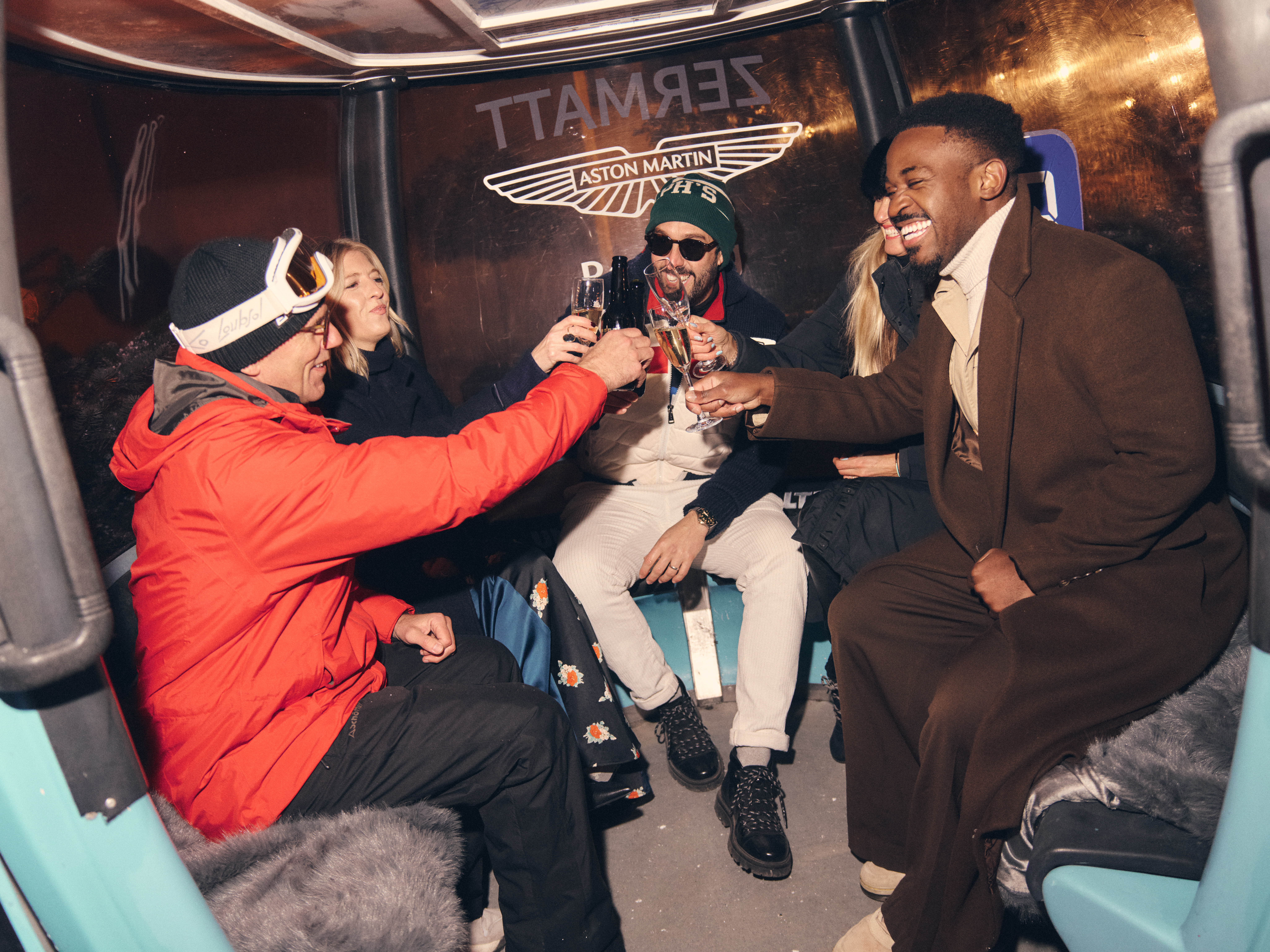 guests sitting in ski gondola